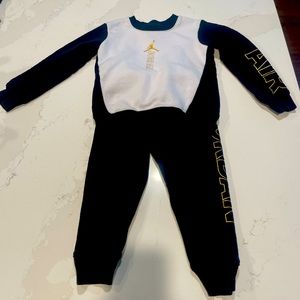 Nike Jordan 3-4 year old black, white, and gold sweatsuit